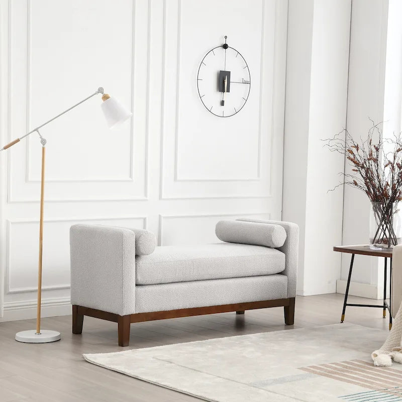Banc/pouf élégant de 53,5 cm de large, capitonné, avec pieds en bois et coussins cylindriques, idéal pour le pied de lit, la chambre, le salon ou l'entrée.