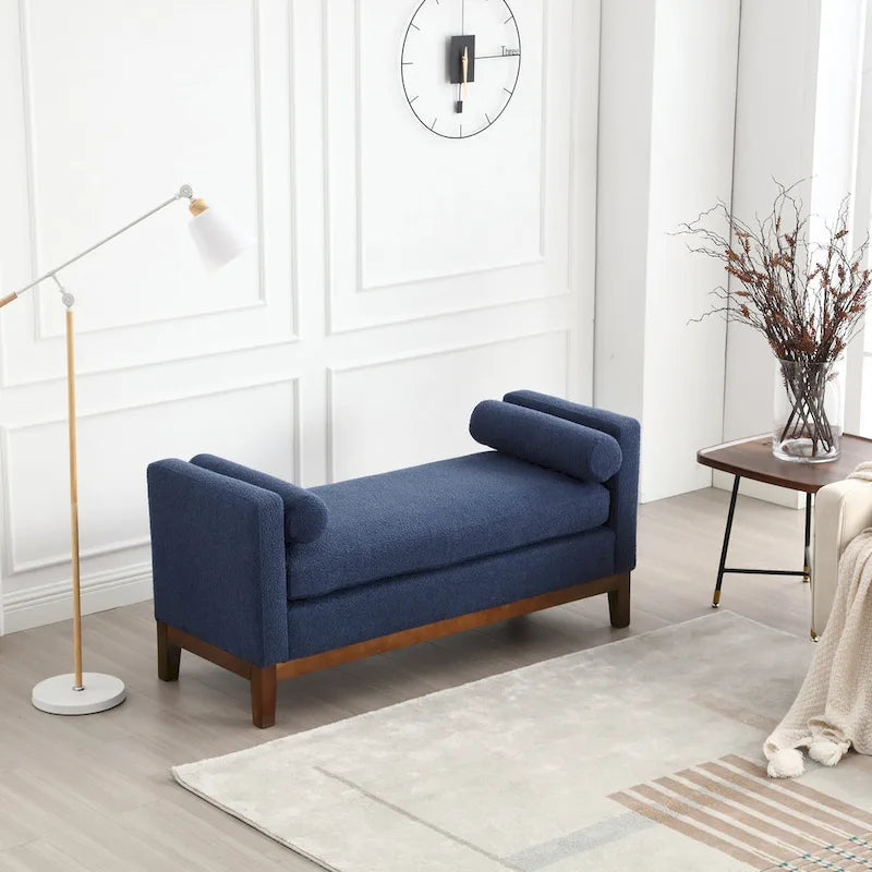 Banc/pouf élégant de 53,5 cm de large, capitonné, avec pieds en bois et coussins cylindriques, idéal pour le pied de lit, la chambre, le salon ou l'entrée.