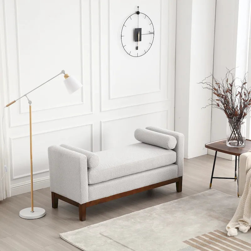 Banc/pouf élégant de 53,5 cm de large, capitonné, avec pieds en bois et coussins cylindriques, idéal pour le pied de lit, la chambre, le salon ou l'entrée.