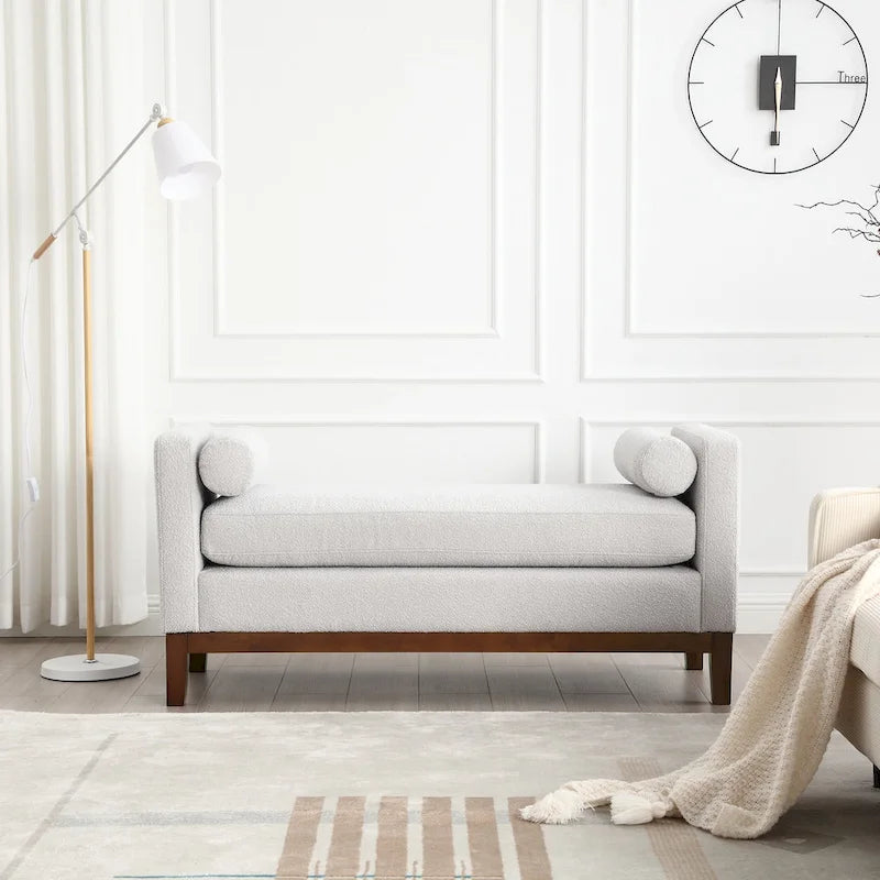 Banc/pouf élégant de 53,5 cm de large, capitonné, avec pieds en bois et coussins cylindriques, idéal pour le pied de lit, la chambre, le salon ou l'entrée.