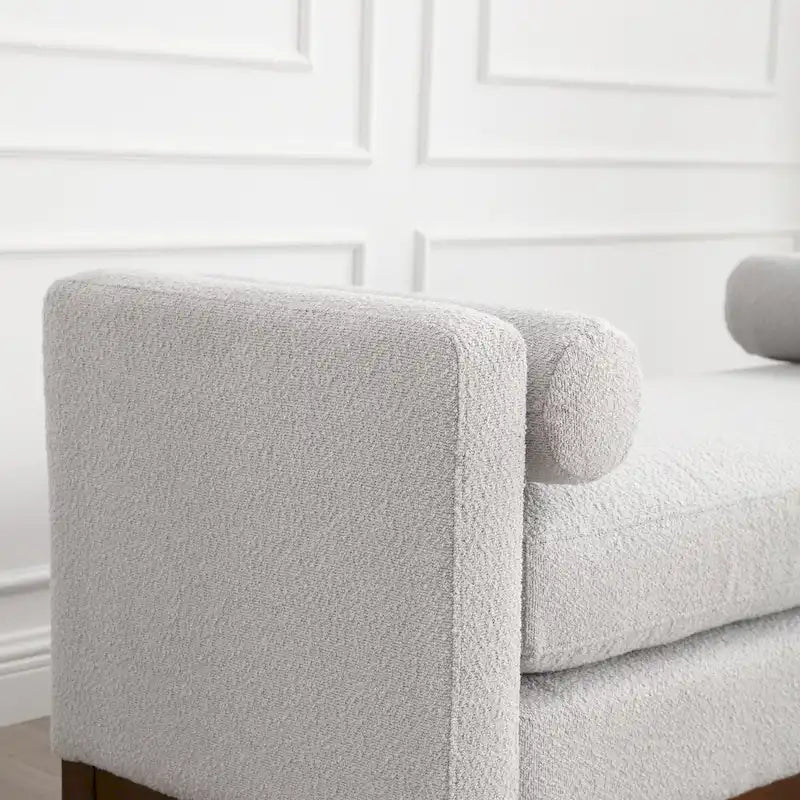 Banc/pouf élégant de 53,5 cm de large, capitonné, avec pieds en bois et coussins cylindriques, idéal pour le pied de lit, la chambre, le salon ou l'entrée.