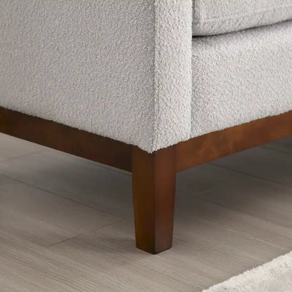 Banc/pouf élégant de 53,5 cm de large, capitonné, avec pieds en bois et coussins cylindriques, idéal pour le pied de lit, la chambre, le salon ou l'entrée.