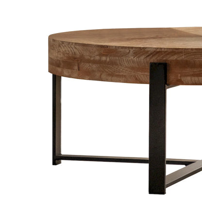 Table basse ronde moderne rétro avec plateau en bois de sapin et piètement croisé noir, idéale pour le salon.