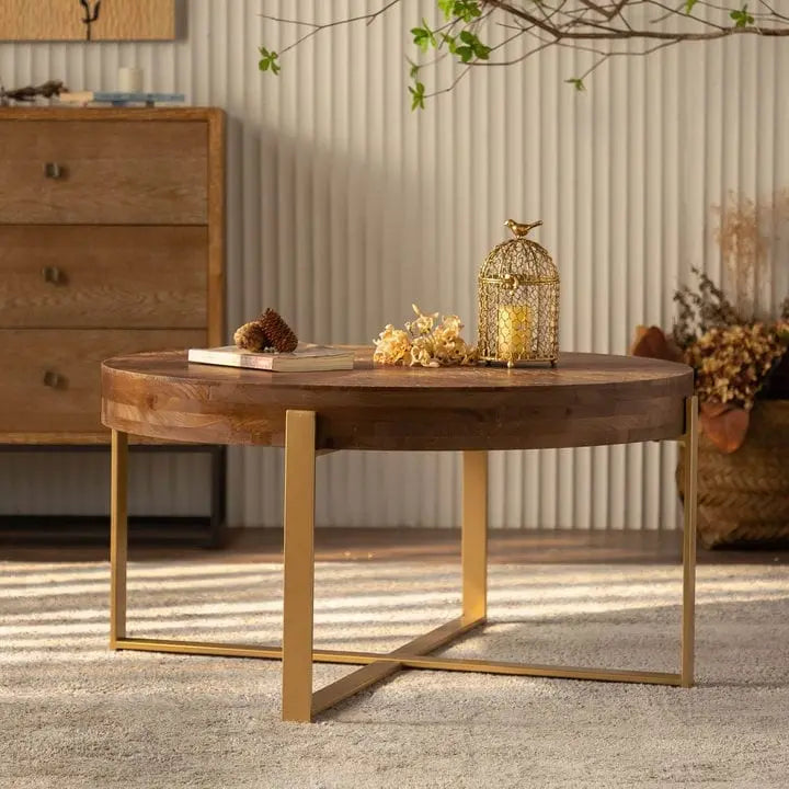 Table basse ronde moderne rétro avec plateau en bois de sapin et piètement croisé noir, idéale pour le salon.