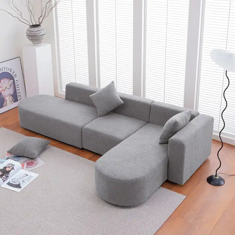 Canapé d'angle moderne en bouclette avec assise incurvée (orienté à droite)