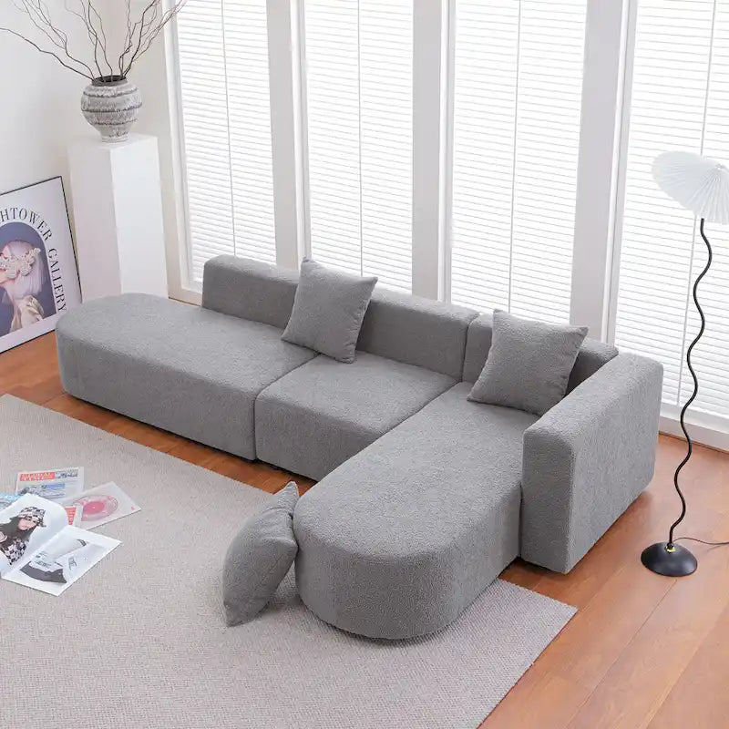 Canapé d'angle moderne en bouclette avec assise incurvée (orienté à droite)