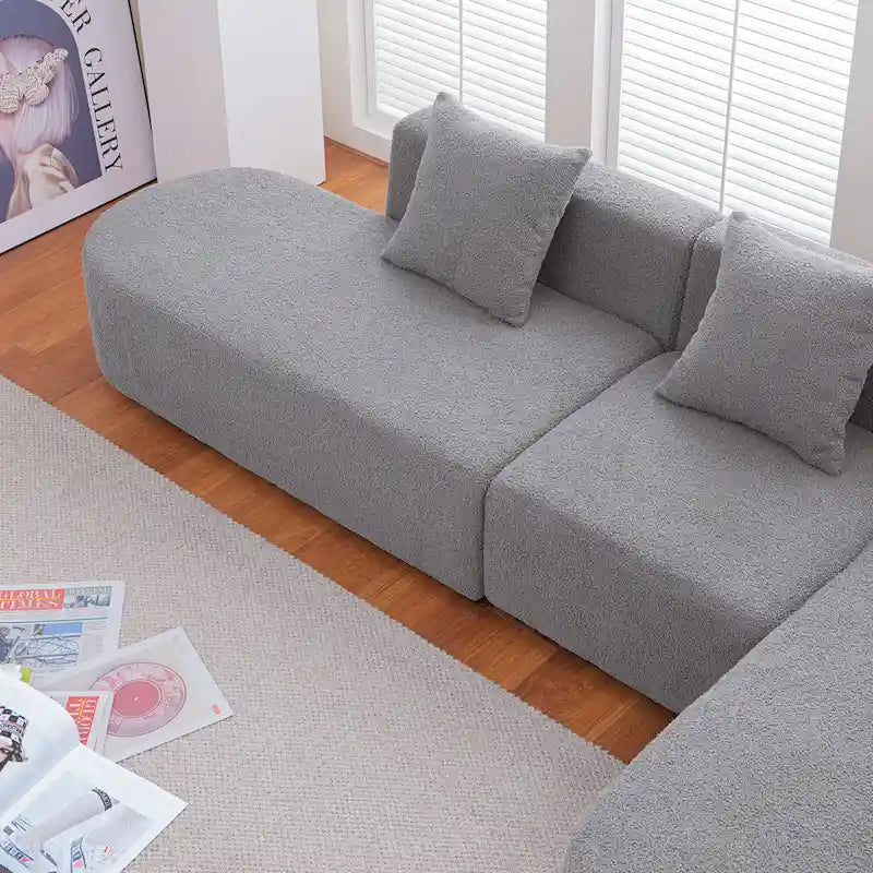 Canapé d'angle moderne en bouclette avec assise incurvée (orienté à droite)