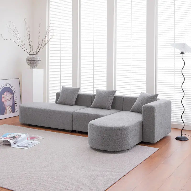Canapé d'angle moderne en bouclette avec assise incurvée (orienté à droite)