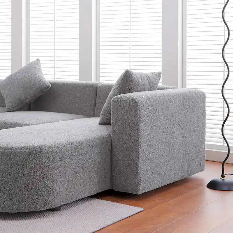 Canapé d'angle moderne en bouclette avec assise incurvée (orienté à droite)