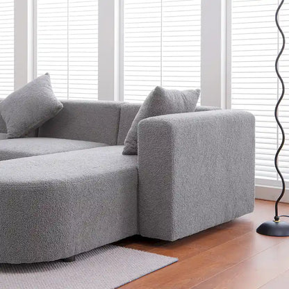 Canapé d'angle moderne en bouclette avec assise incurvée (orienté à droite)
