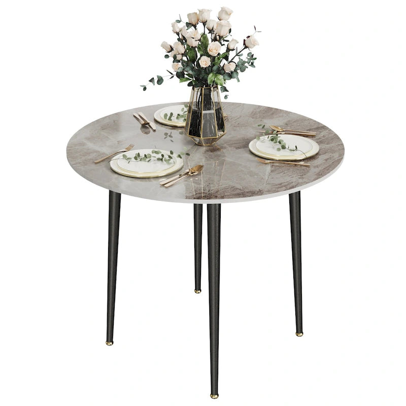 Table de salle à manger ronde avec plateau en marbre et pieds en métal, idéale pour la salle à manger ou la cuisine.